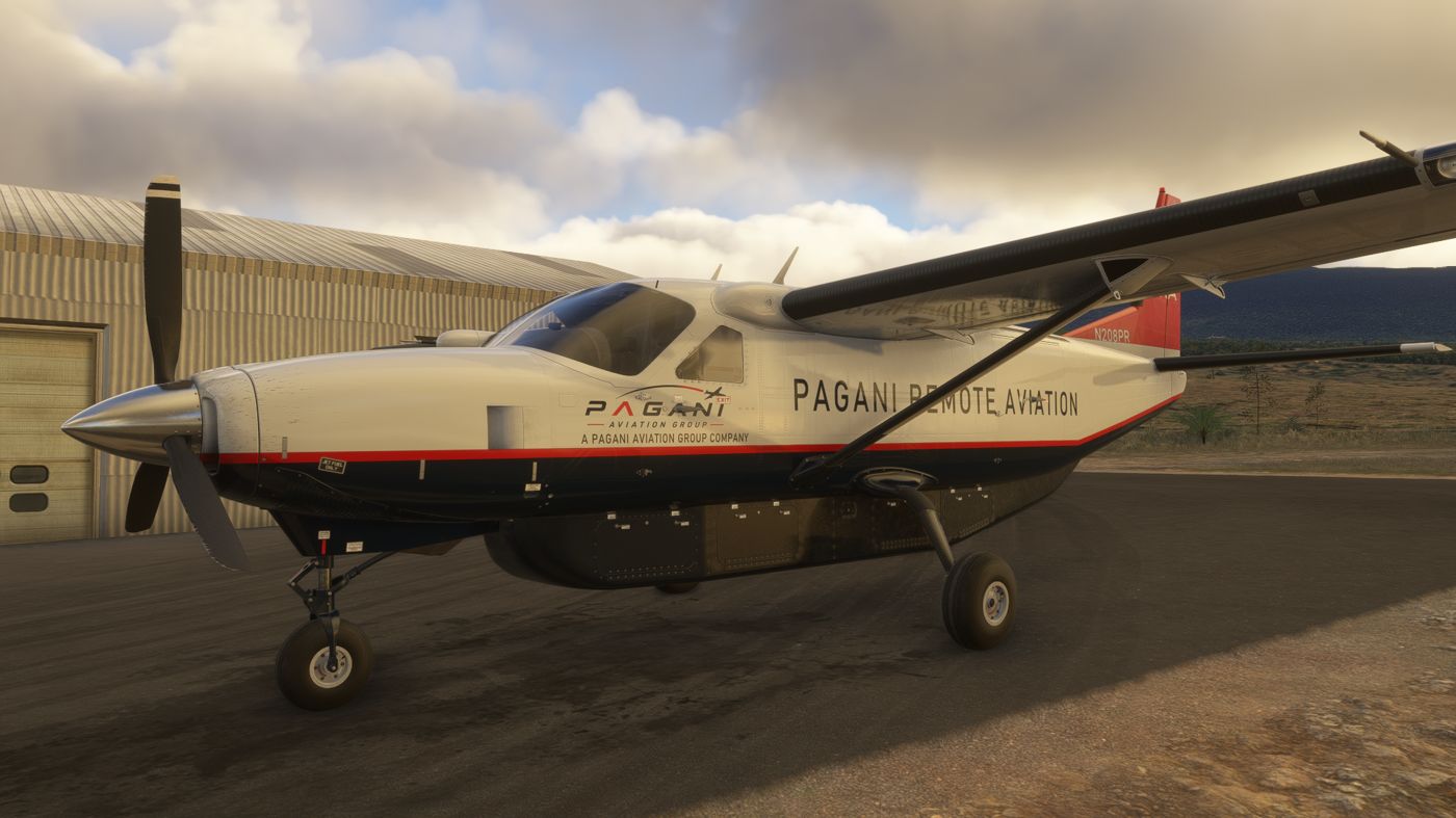 Cessna 208B Super Cargomaster N208PR in PRA livery parked by a hangar